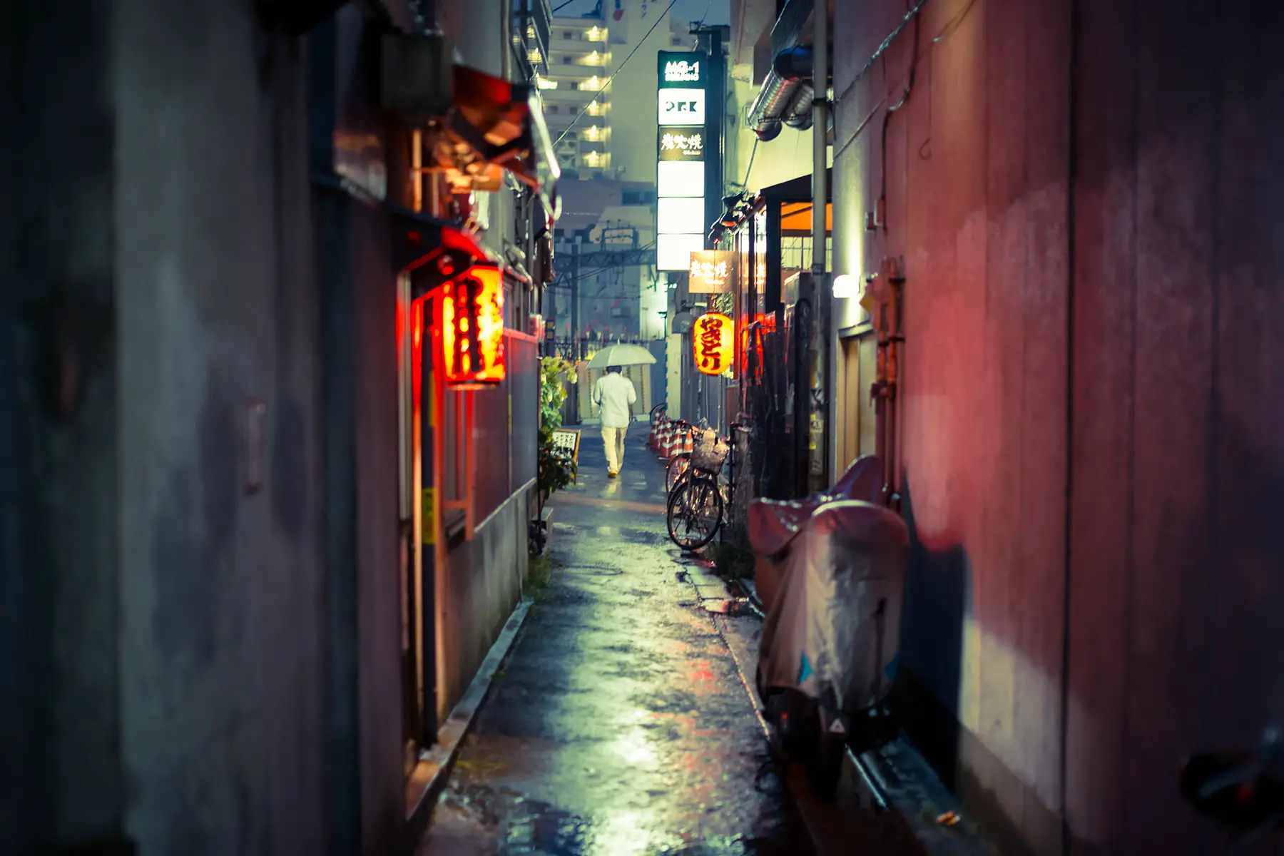 An alley in Shimokitazawa neighborhood in Tokyo, Japan, moody street lighting