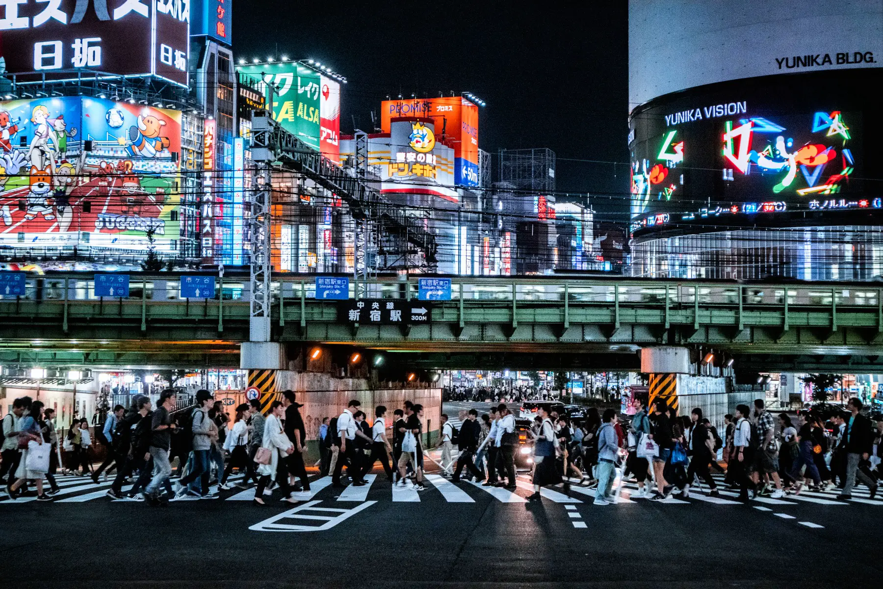 A busy crossing at Shinjuku during nighttime rush hour
