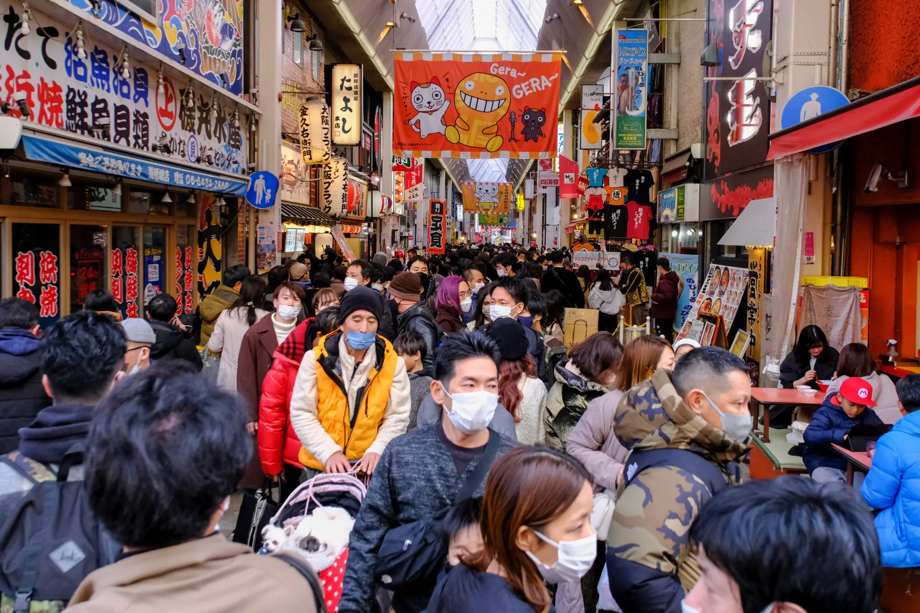 A busy crowd fills the streets of Shinsaibashi to visit the local market 