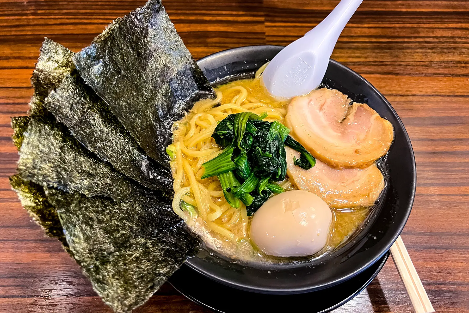 Tonkotsu ramen: a noodle soup with pork belly, soft-boiled egg, and nori (seaweed)