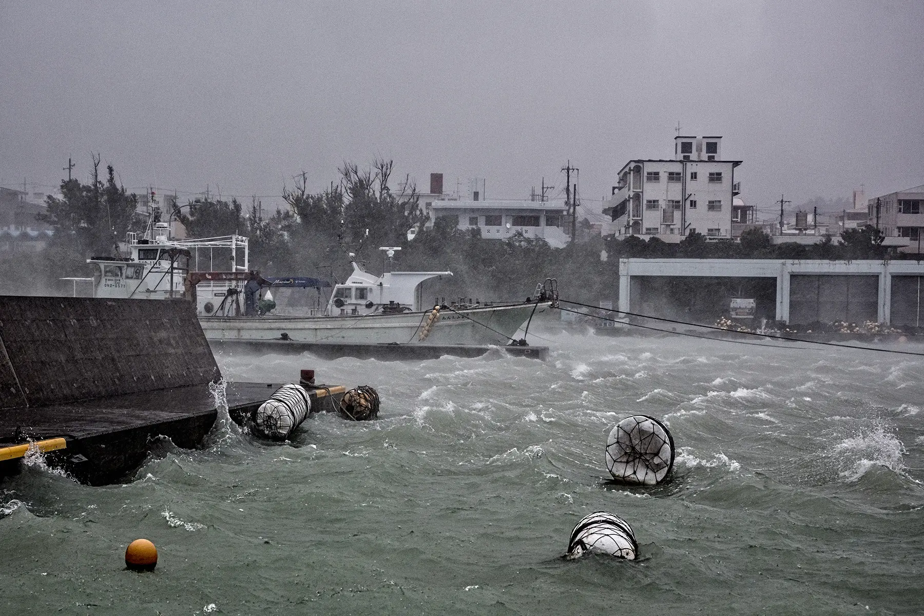 Typhoon creates waves across the water of Yomitan port in Okinawa