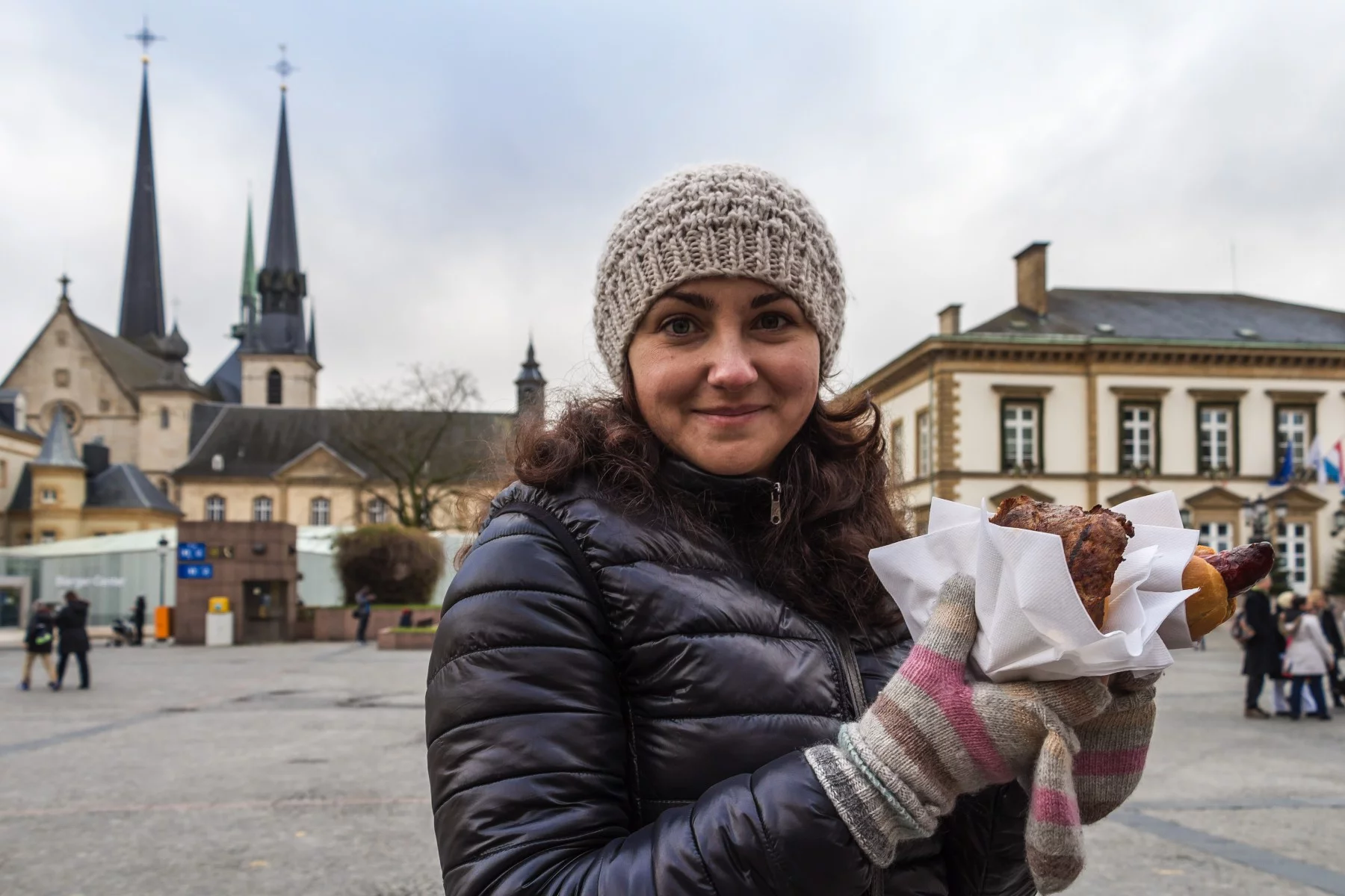 Woman with food at a Luxembourg Christmas market