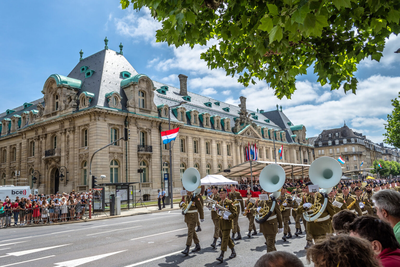 An orchestra parades through the streets to celebrate Luxembourg's National Day