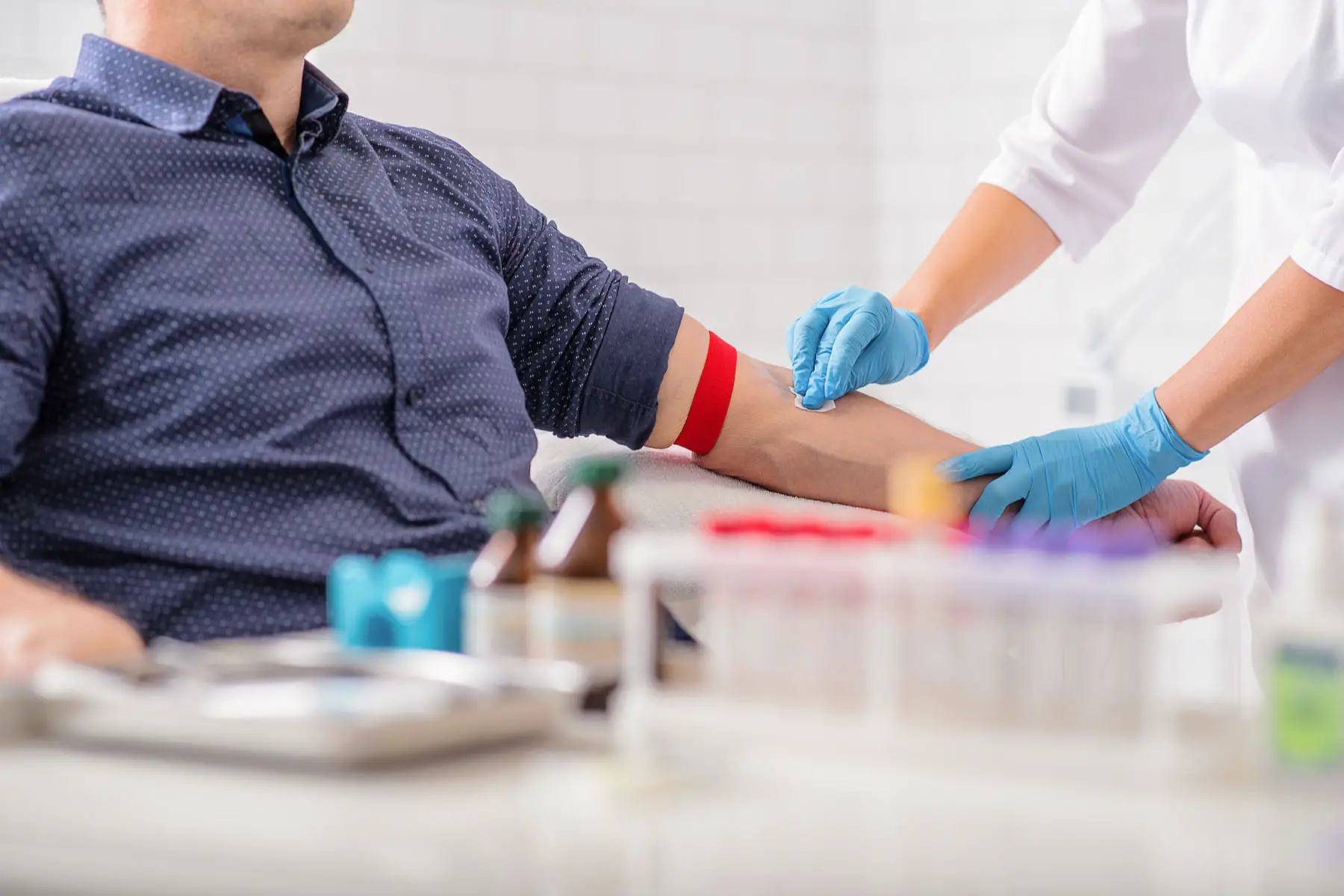 a nurse draws blood for medical tests