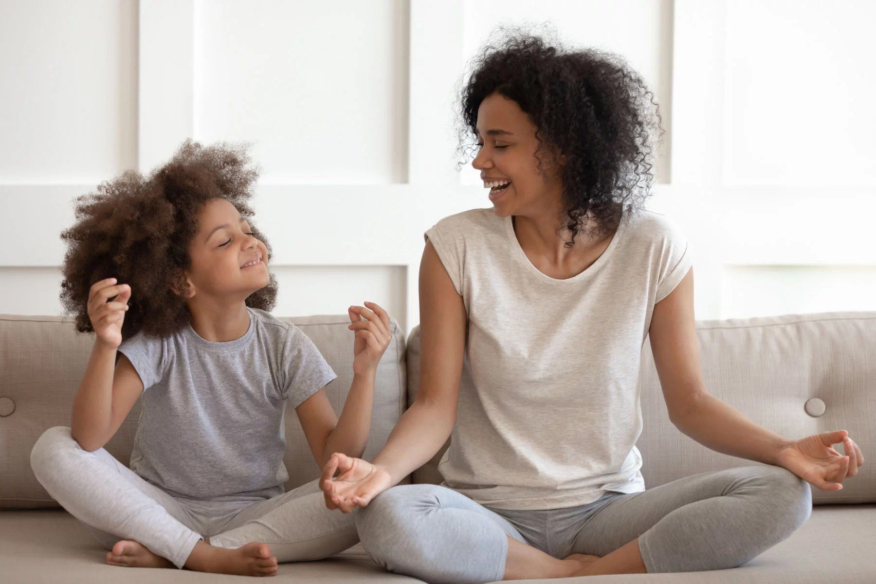 Luxembourg mental health: a mom and daughter meditating 