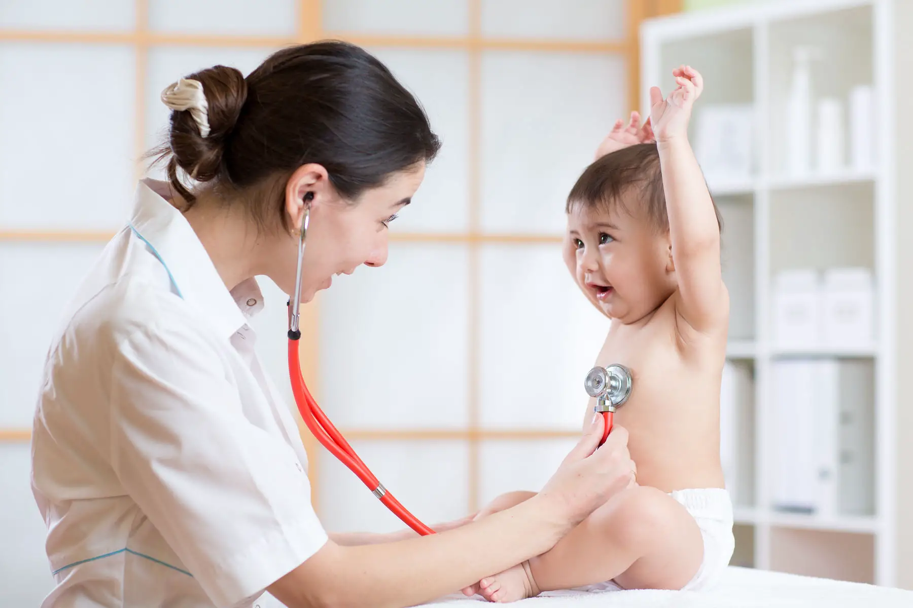 Luxembourg children's healthcare: a pediatrician examines a baby