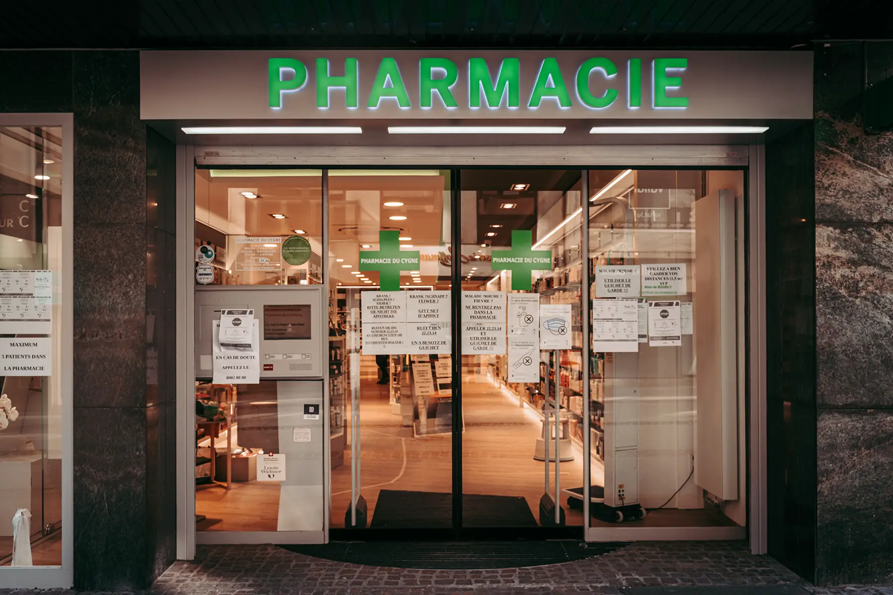 An open pharmacy shown from outside the front door in Luxembourg City