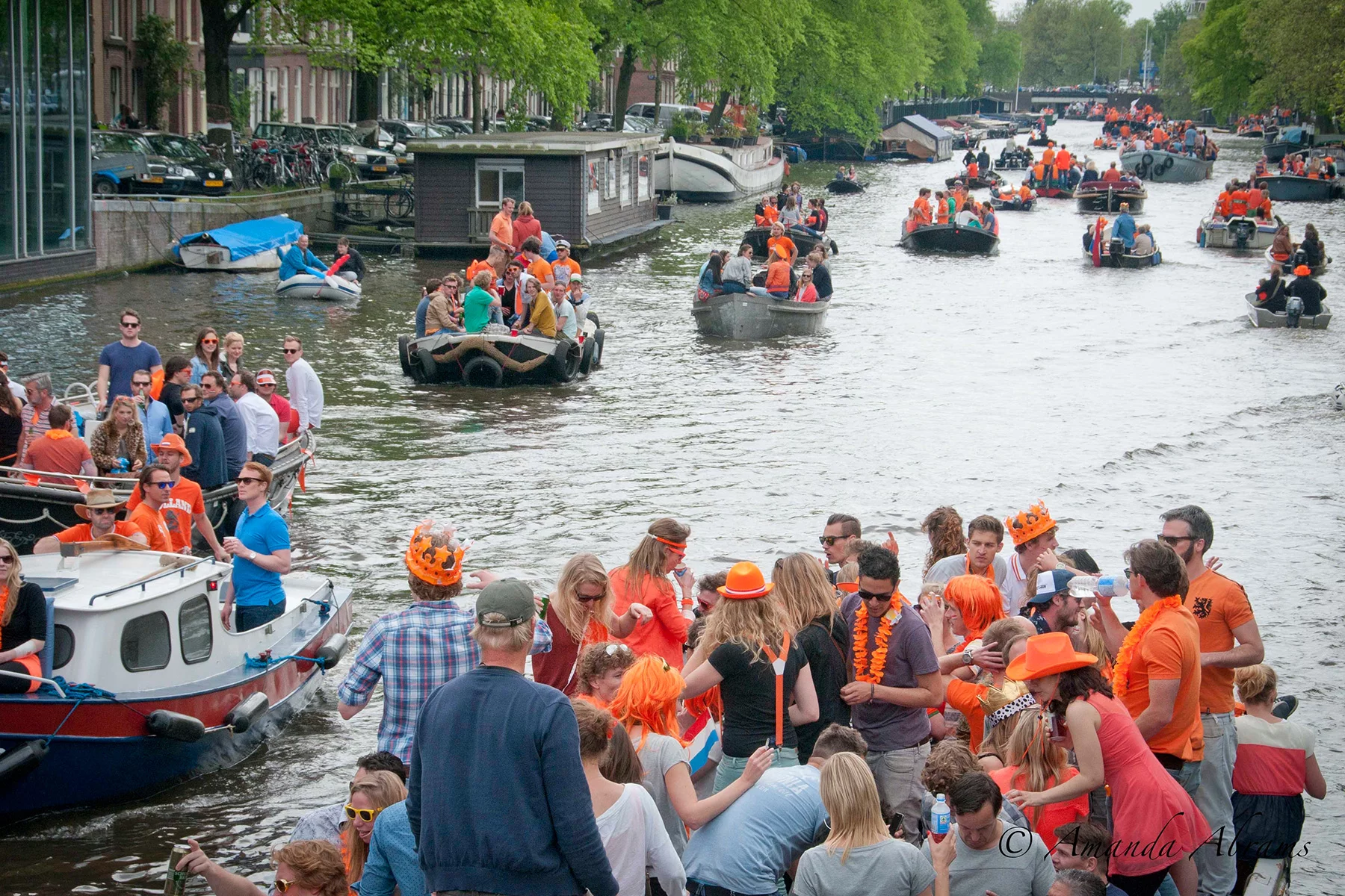 Boats on an Amsterdam canal on Koningsdag
