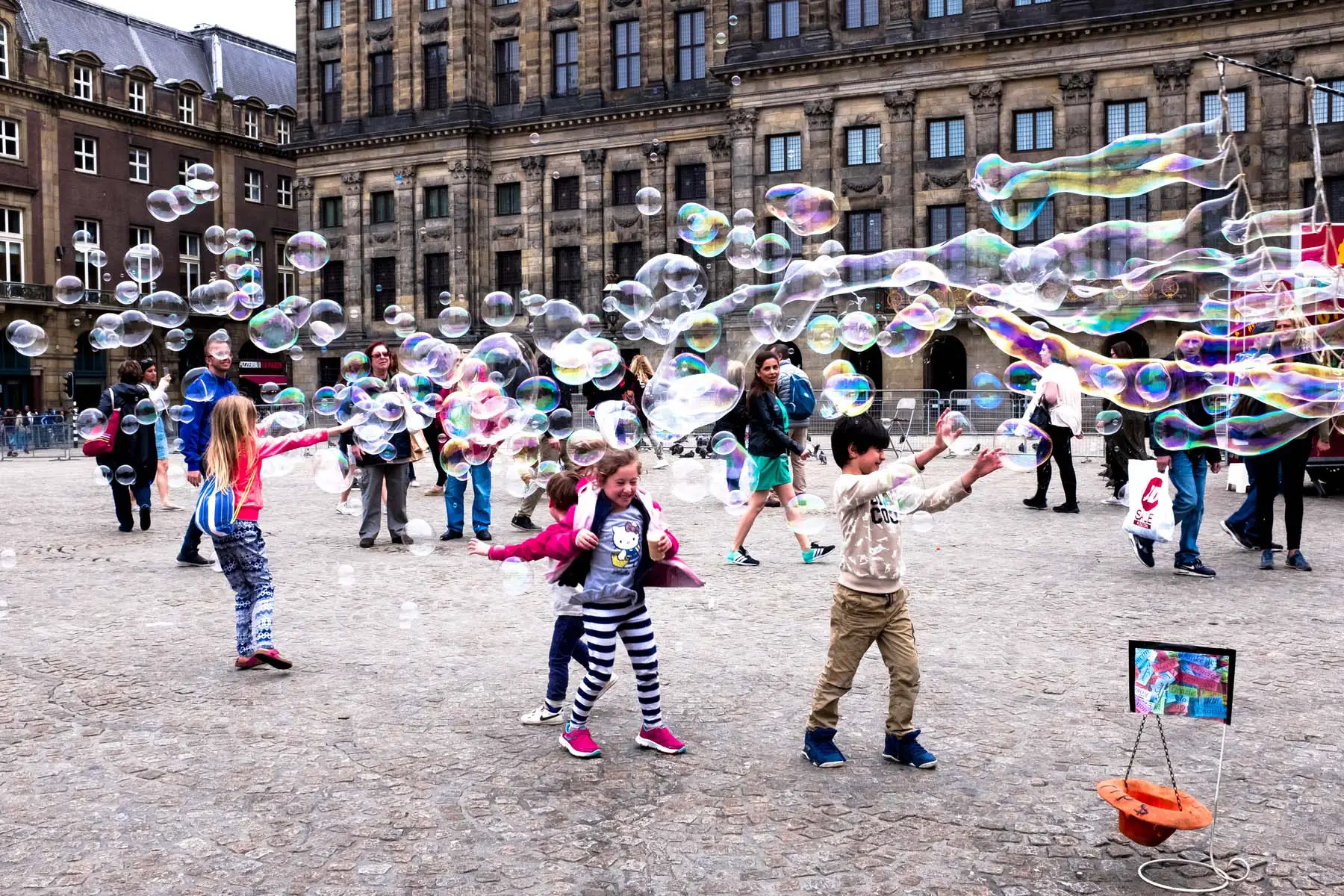 group of children playing with bubbles 