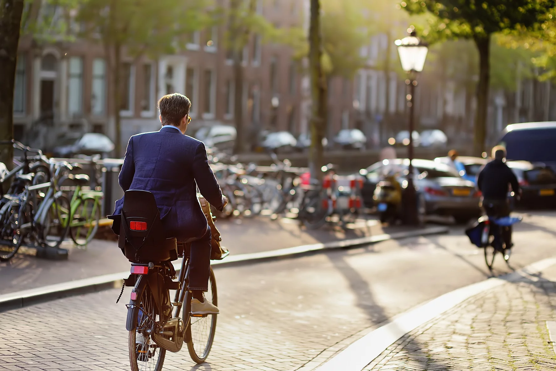Businessman on his bicycle in Amsterdam