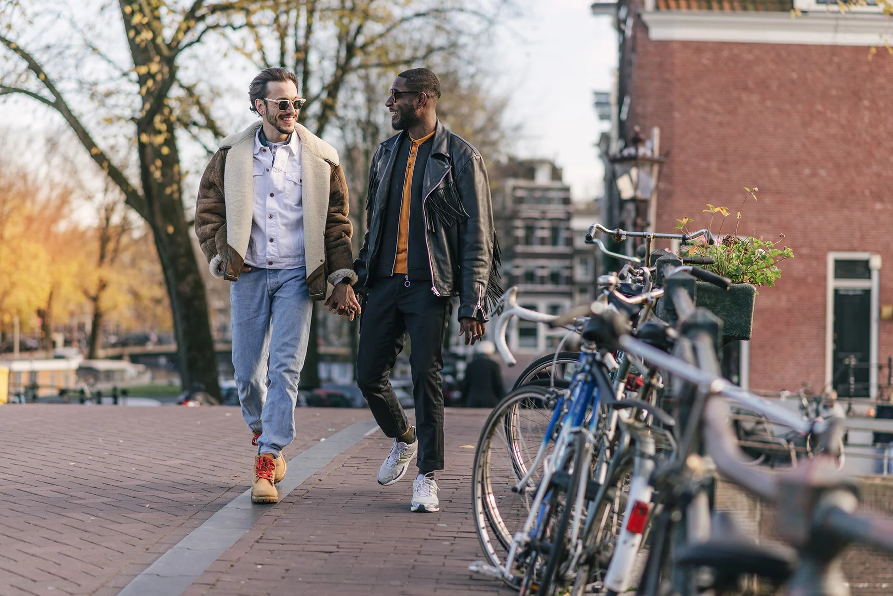 A gay male couple walking in Amsterdam