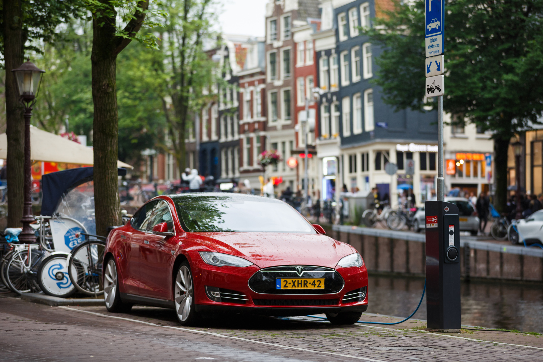 An electric car charging in Amsterdam