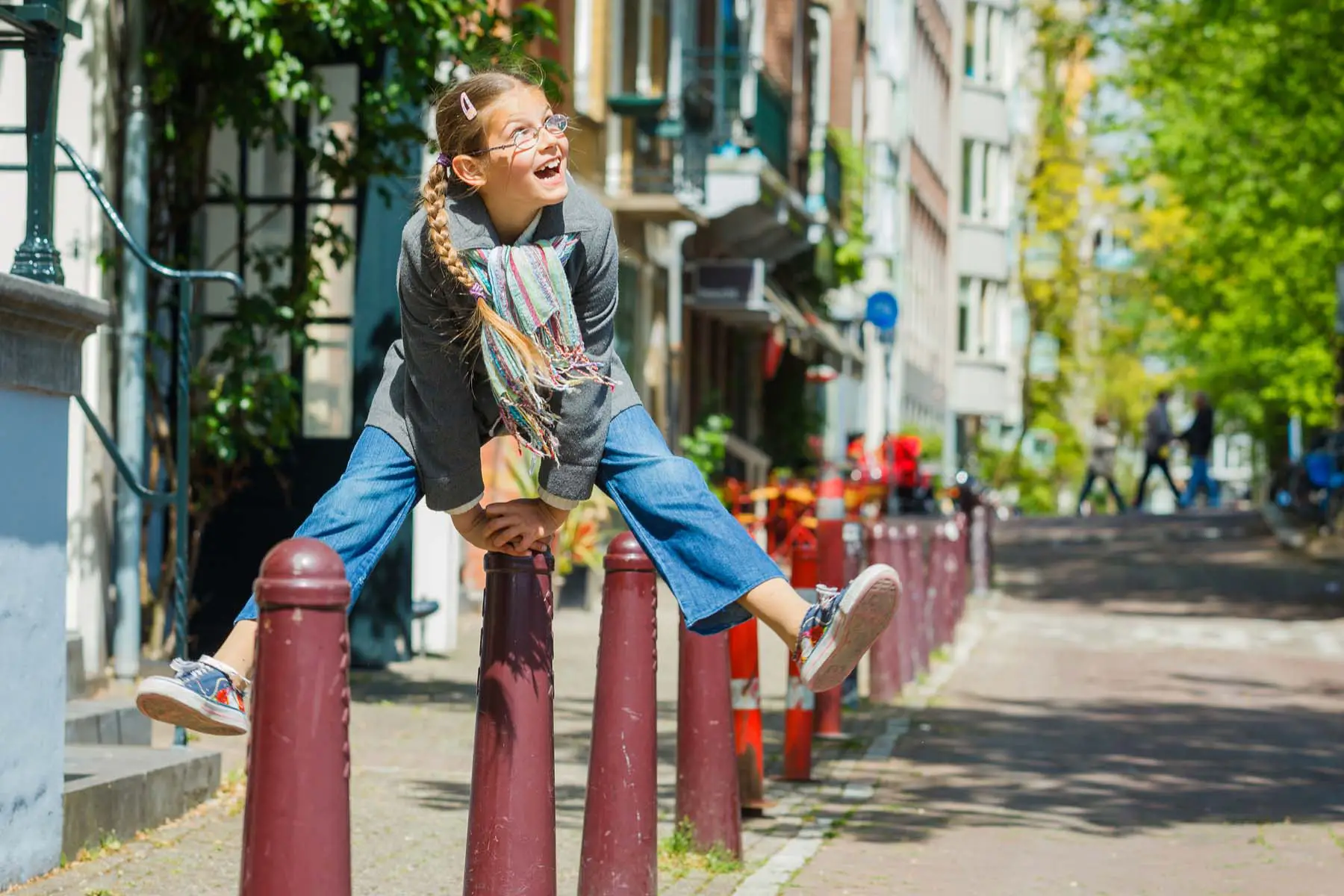 girl jumping over a bollard in the Netherlands