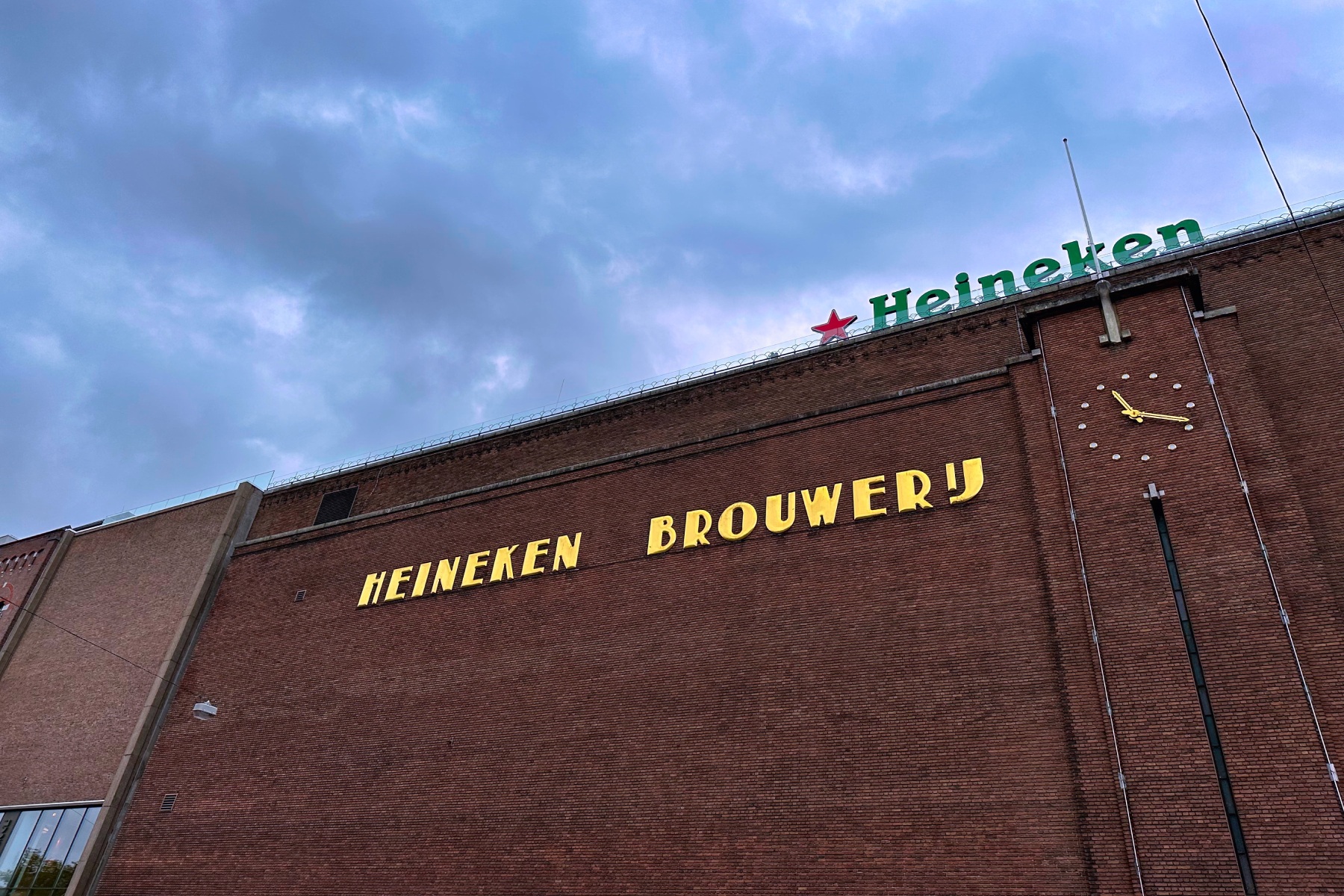 An exterior shot of the Heineken Brewery in Amsterdam with its red brick walls