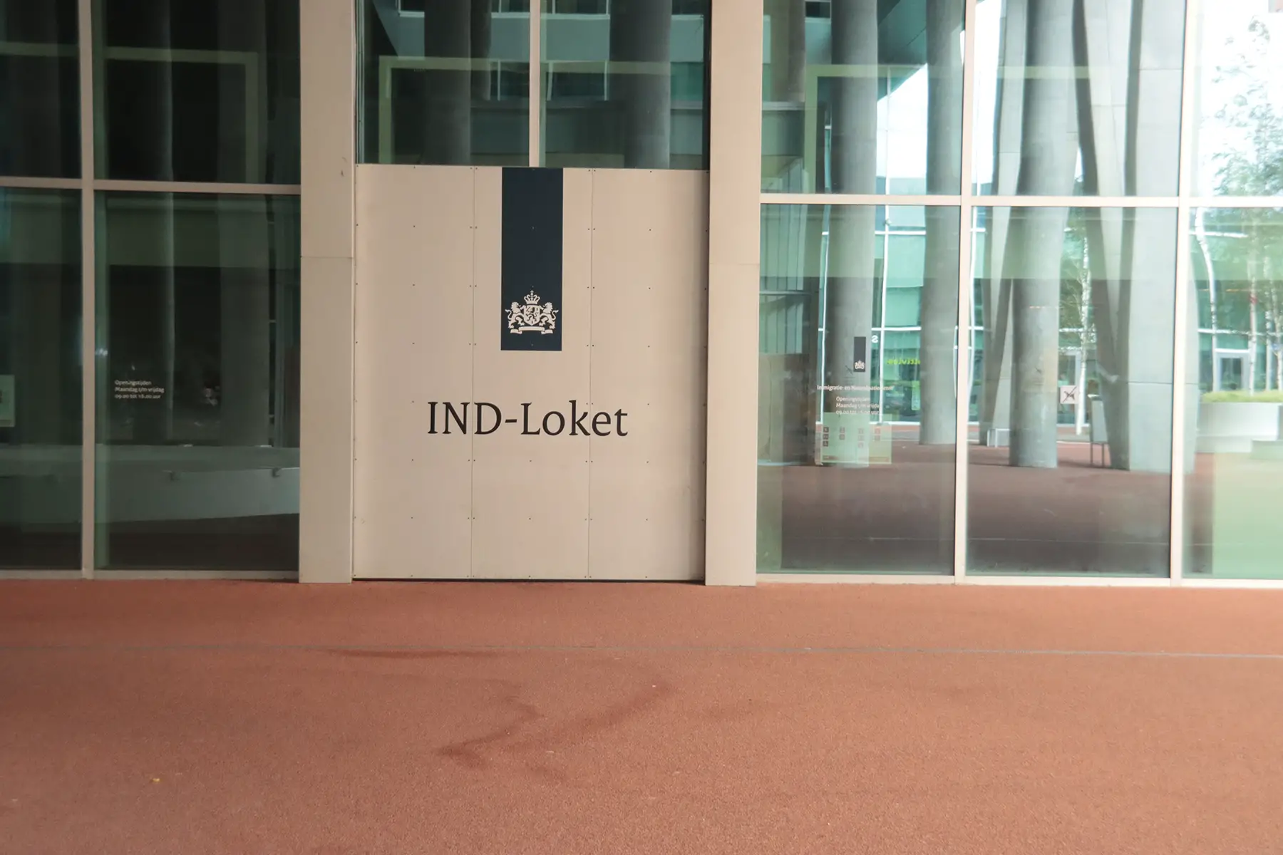 Immigration office in The Hague. Sign says IND-Loket.