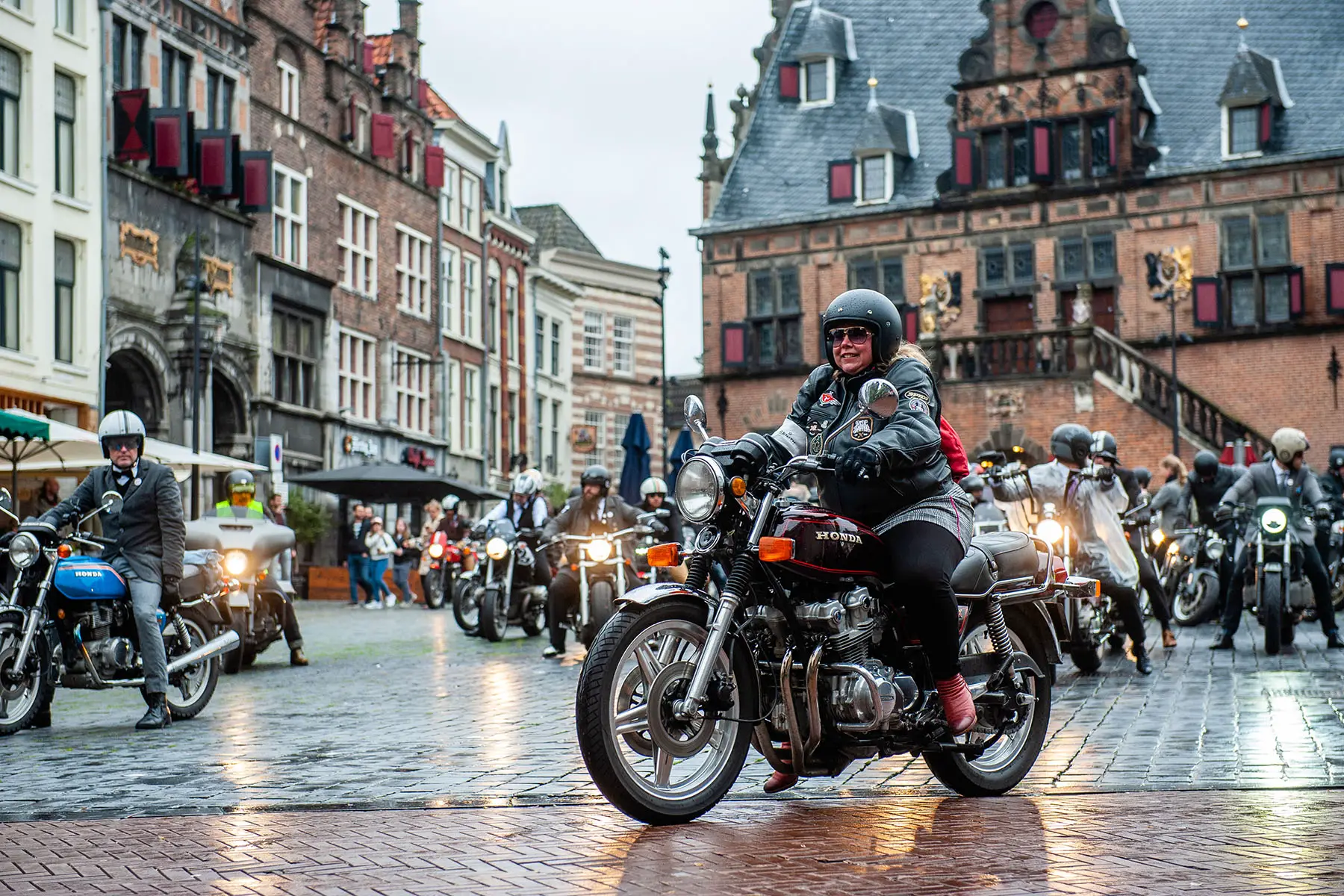 Woman on a motorcycle during the 2019 Distinguished Gentleman's Ride in Nijmegen, the Netherlands.