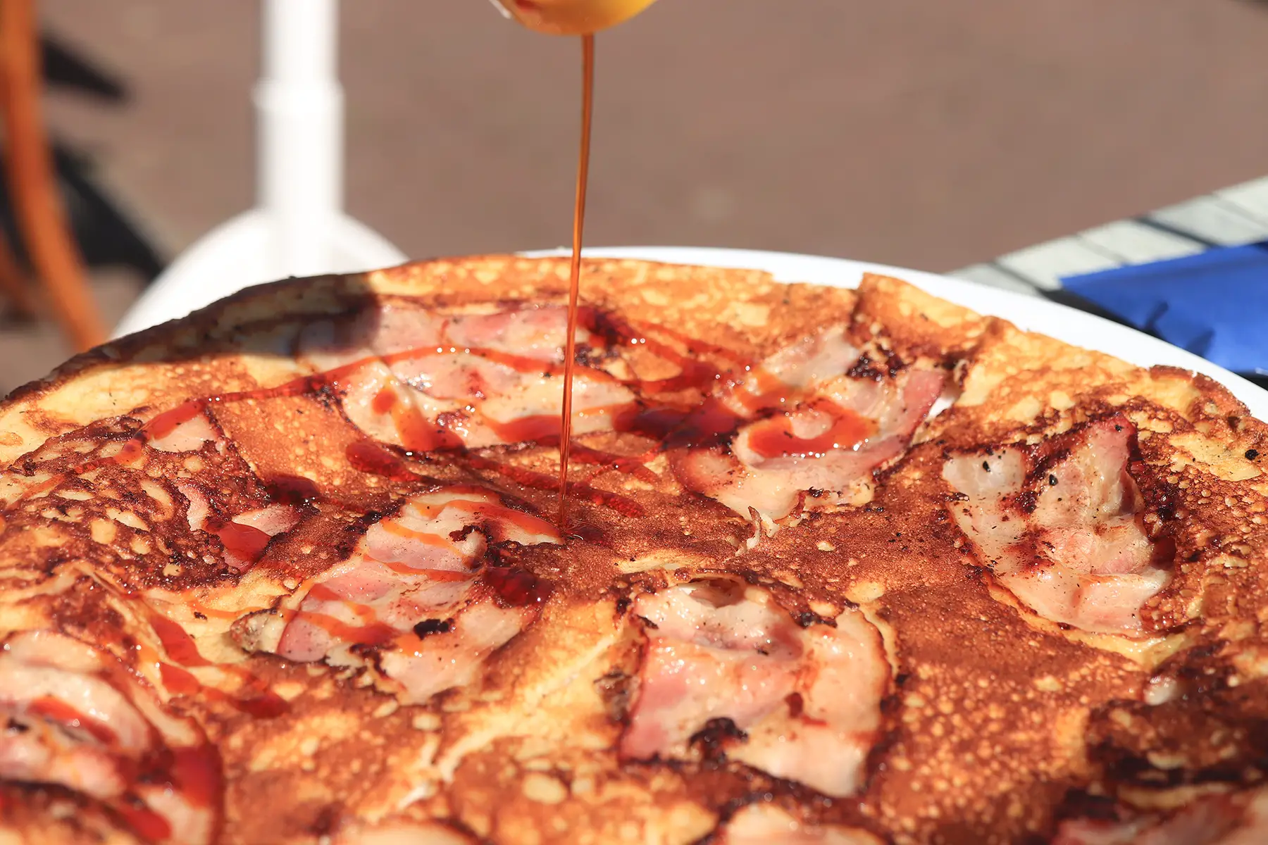 Dutch pancake with bacon and syrup