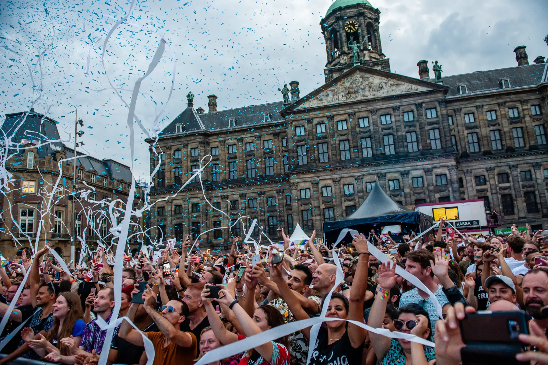 Streamers flying over crowds of people celebrating Pride Amsterdam's Closing Party
