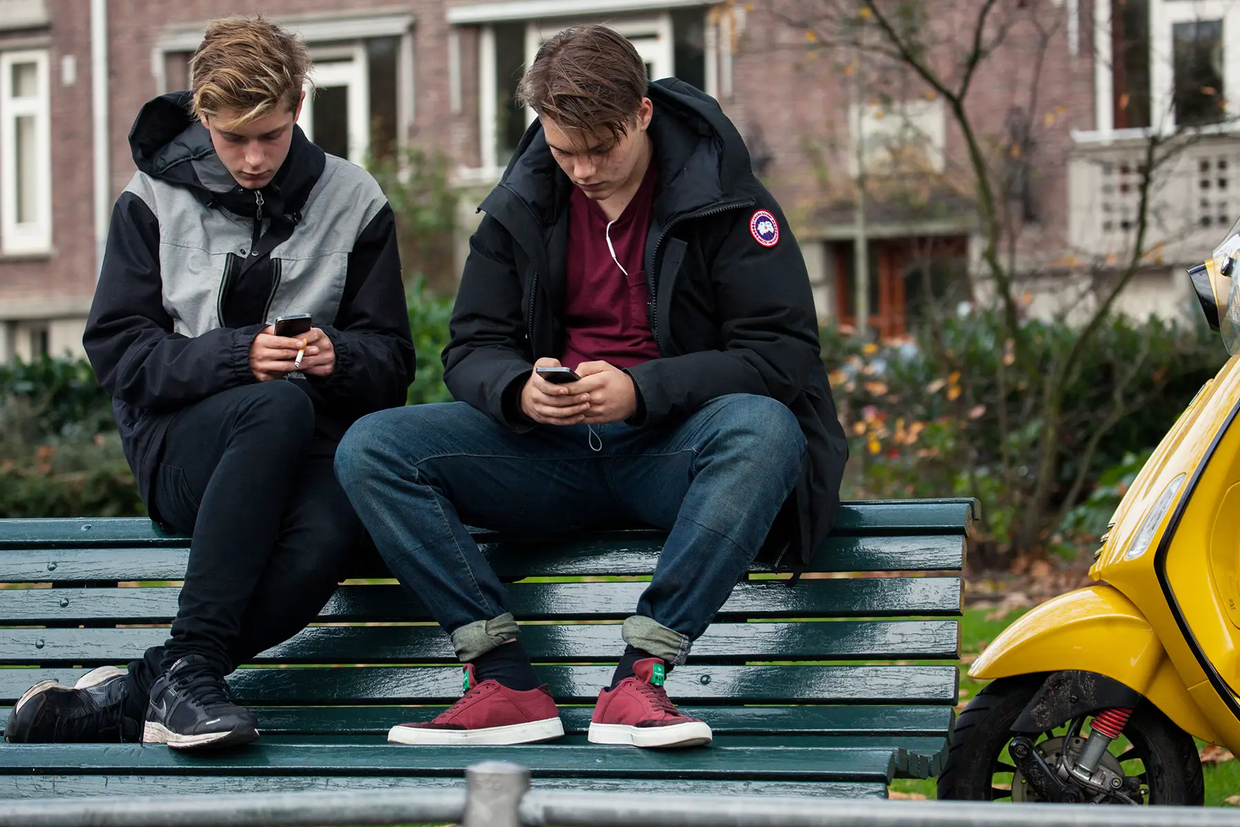 Teenagers in Amsterdam using their phones