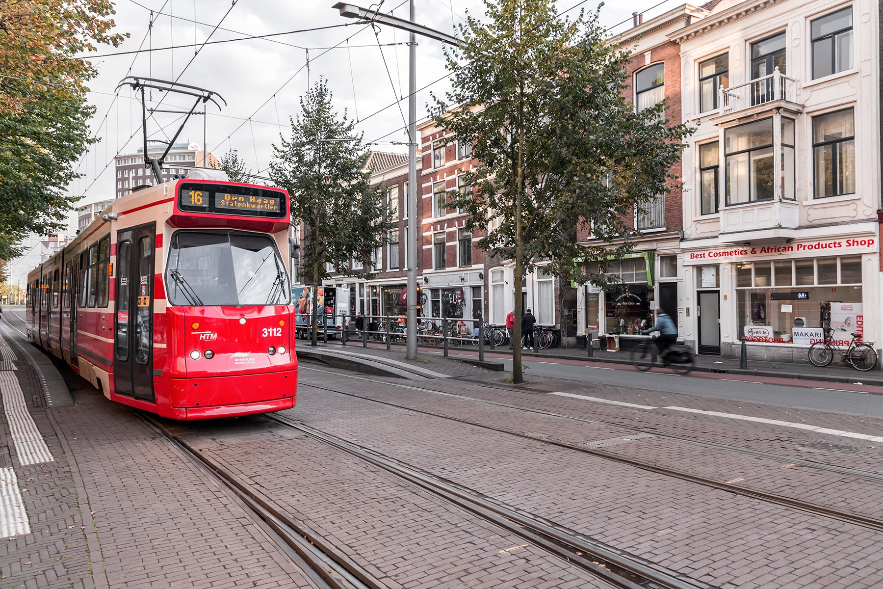 Red and beige tram 16 in The Hague