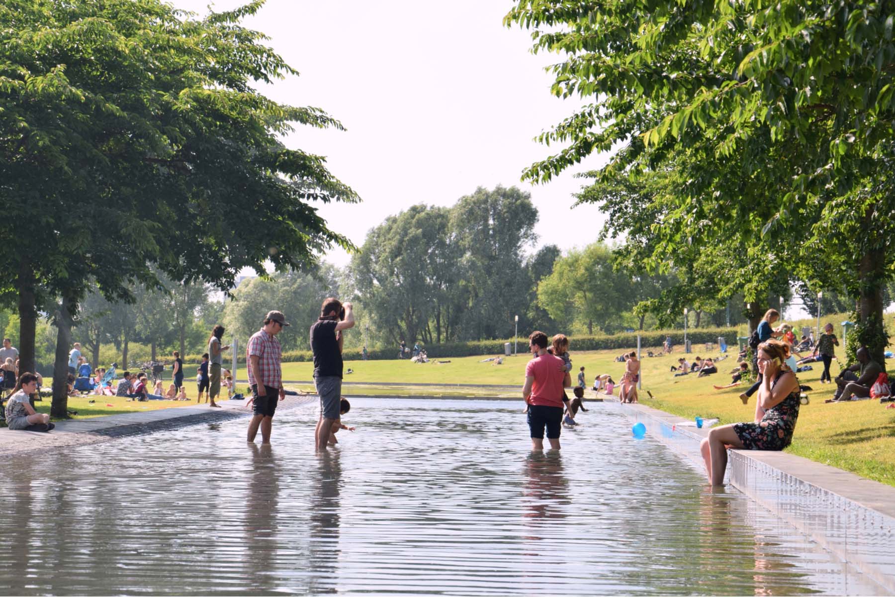 families playing in pools in Westerpark, Amsterdam West