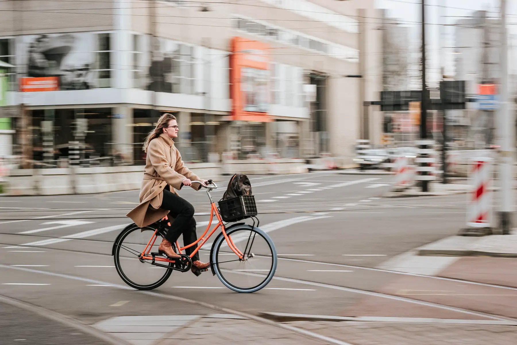 Woman cycling on her bike through Rotterdam