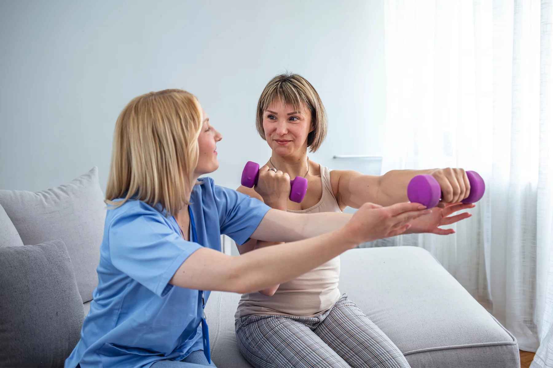 Woman exercising with a physiotherapist