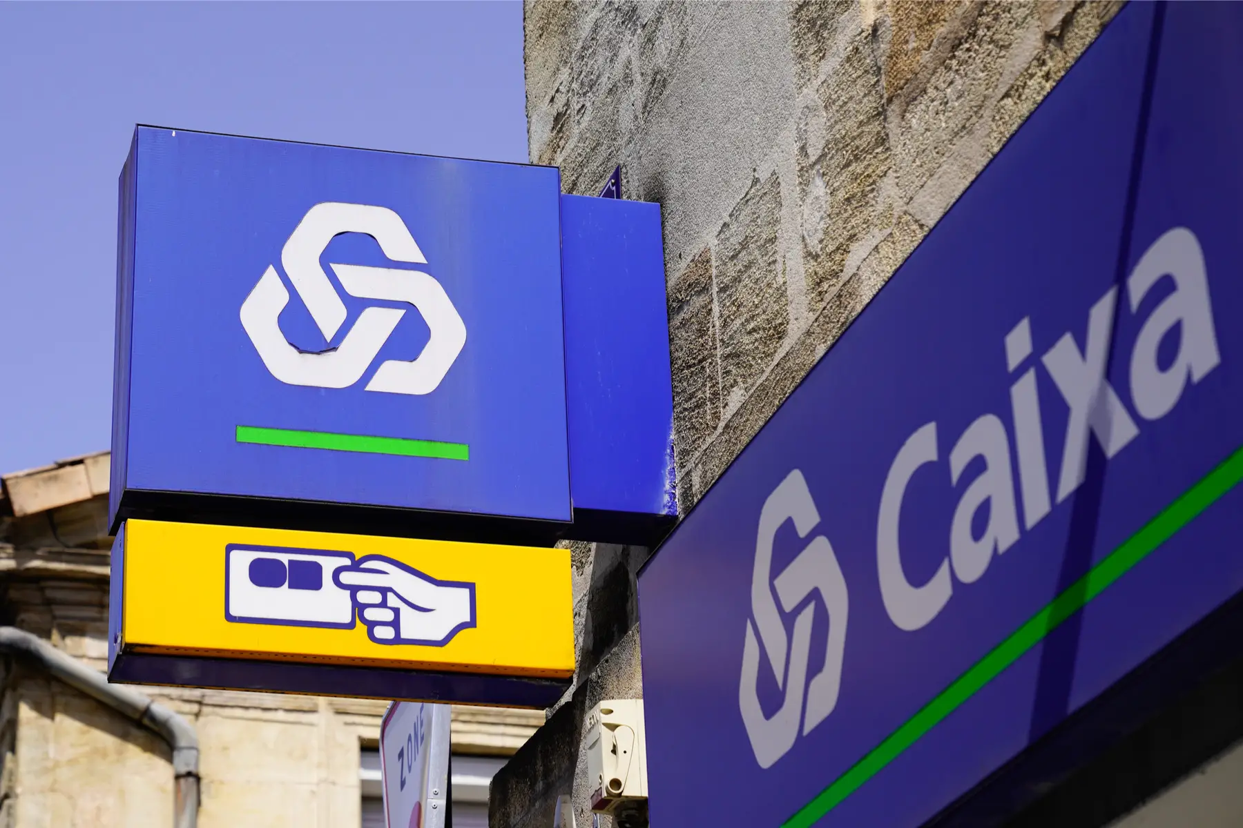 money transfers: signage for Caixa bank in Portugal