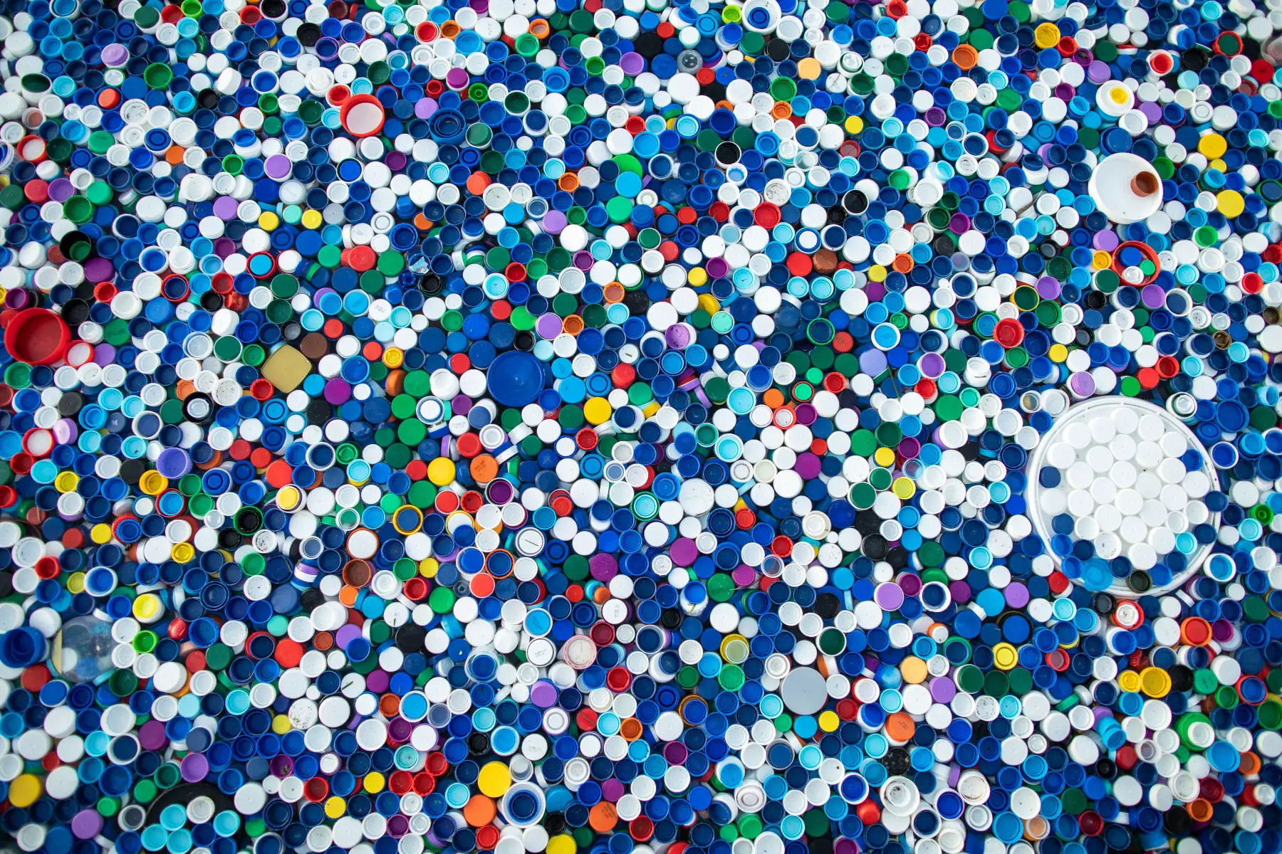 Colorful bottle lids ready for recycling
