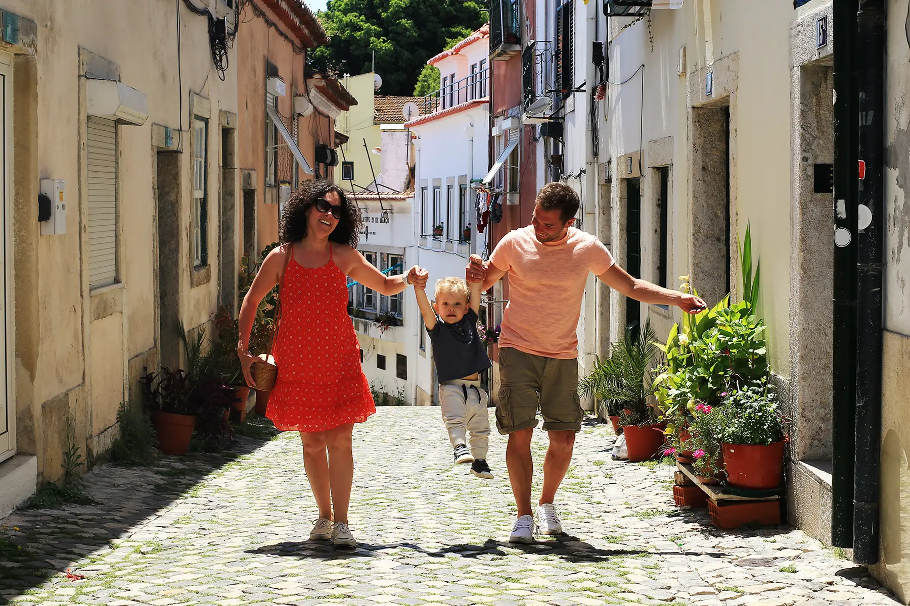 Family walking through Lisbon, Portugal