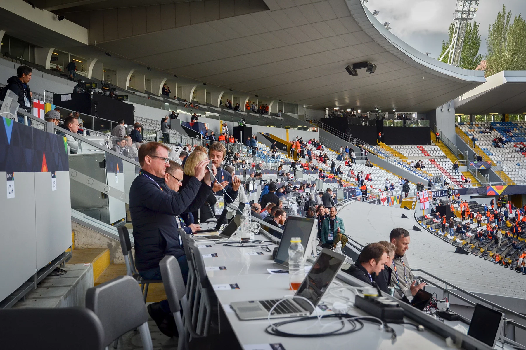 Freelance football journalists working at a match in Portugal
