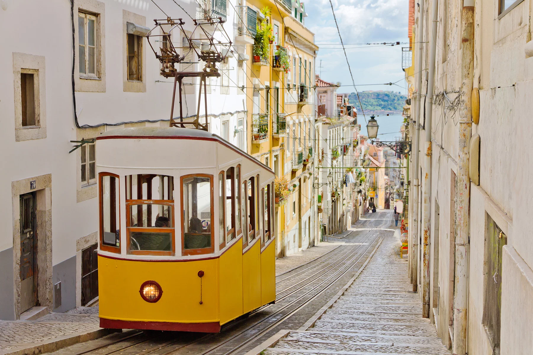 Historical tram on an old street in Lisbon