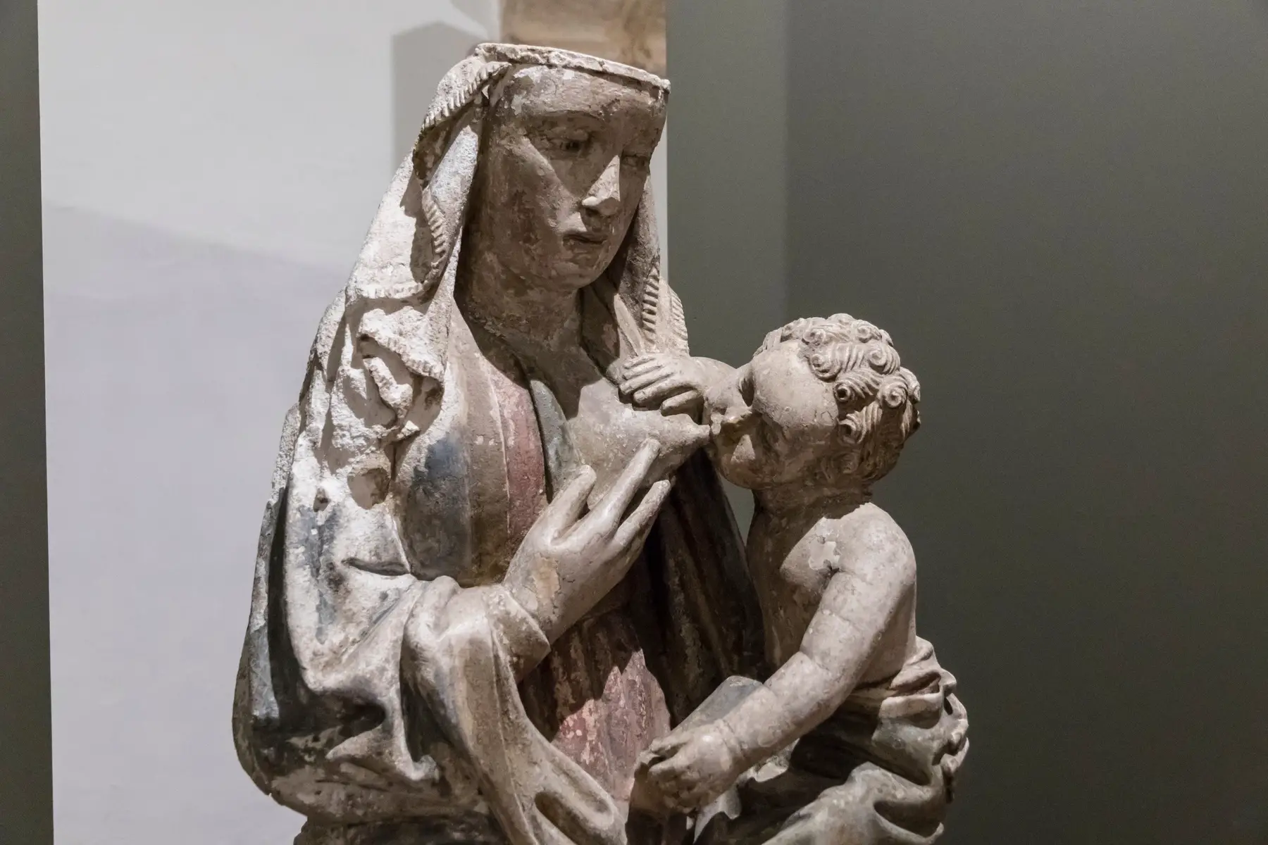 a medieval gothic statue of a Nursing Madonna in Tomar, Portugal 