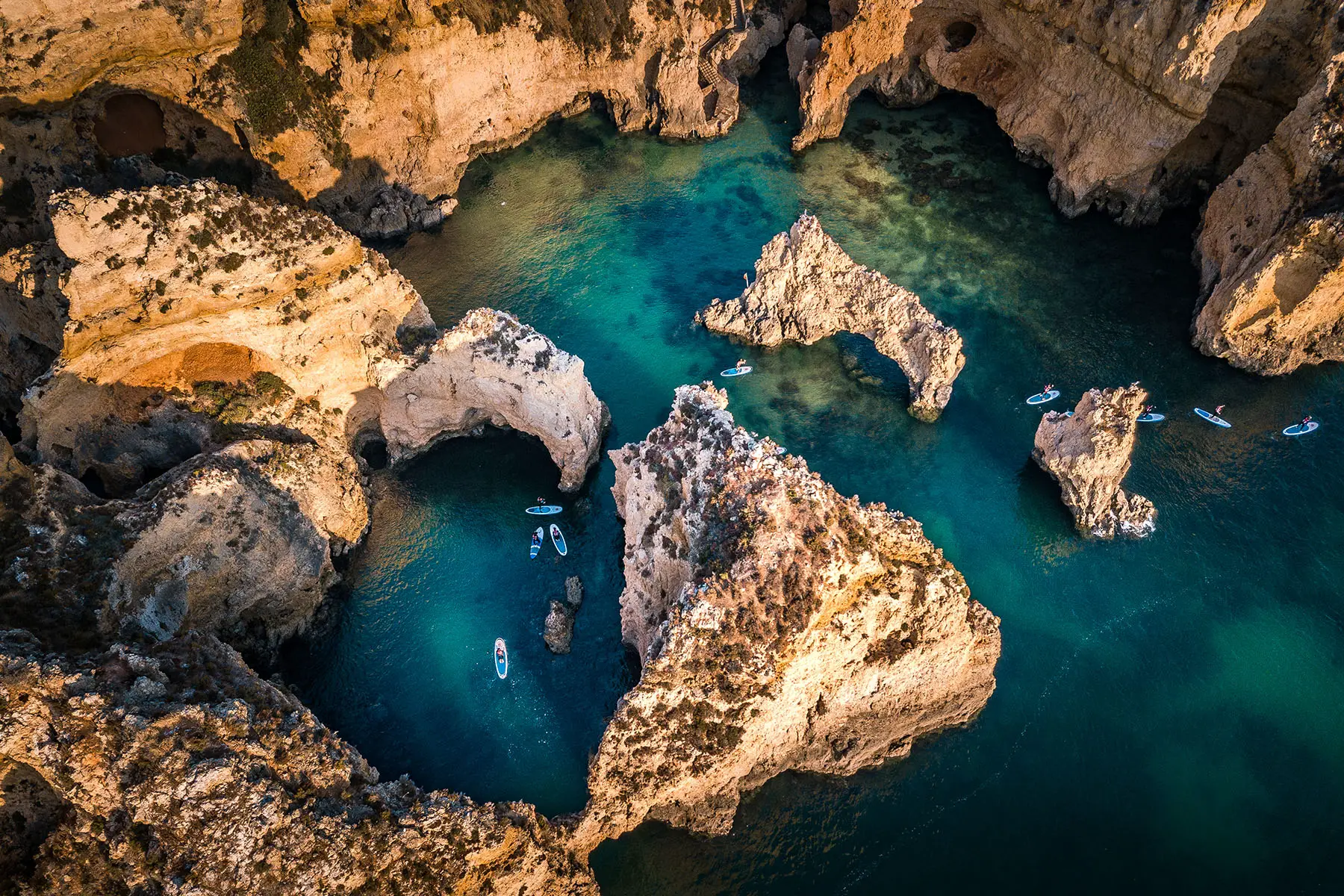 Paddle boarders on the water at Ponta da Piedade, Portugal