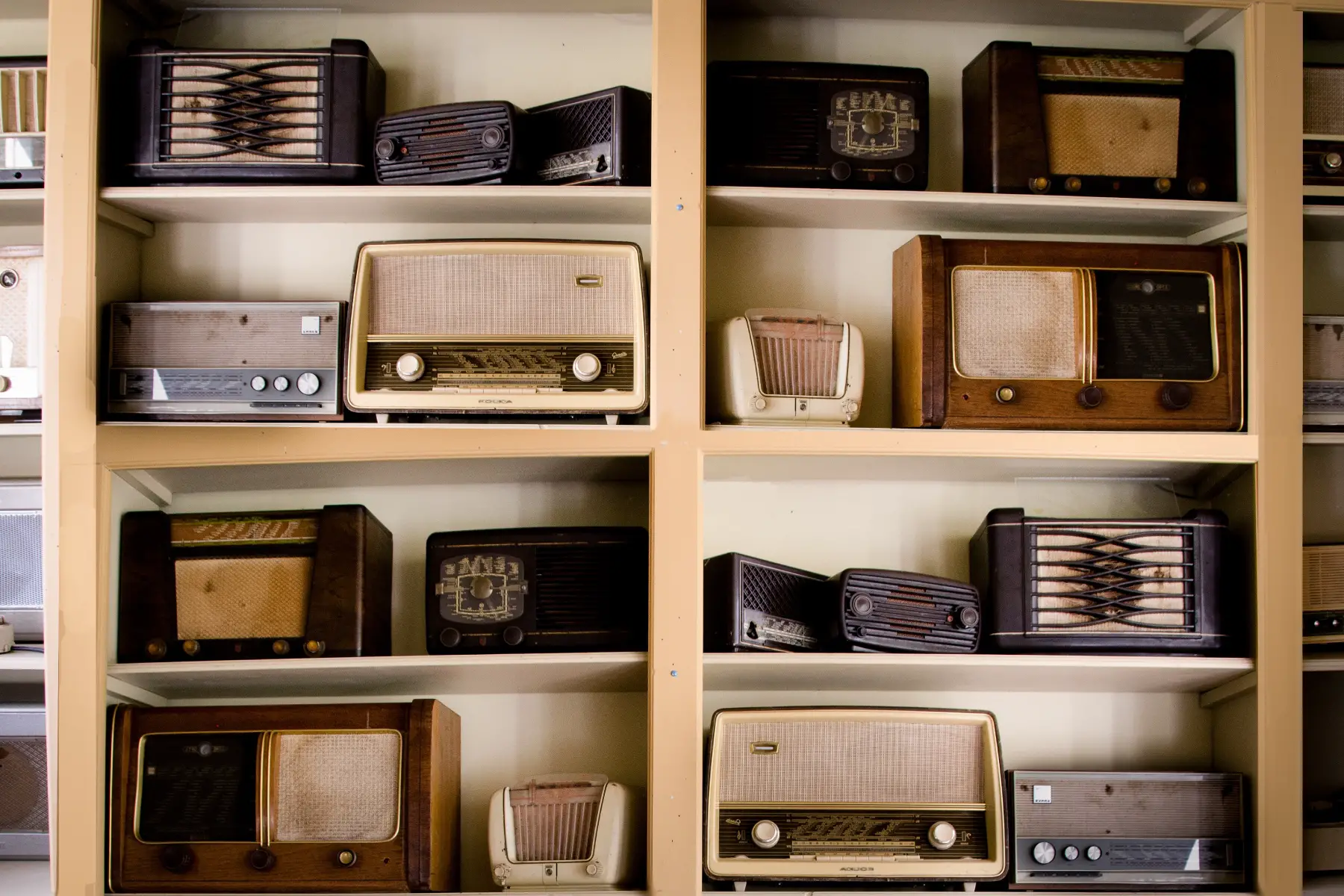 Shelf filled with retro radios