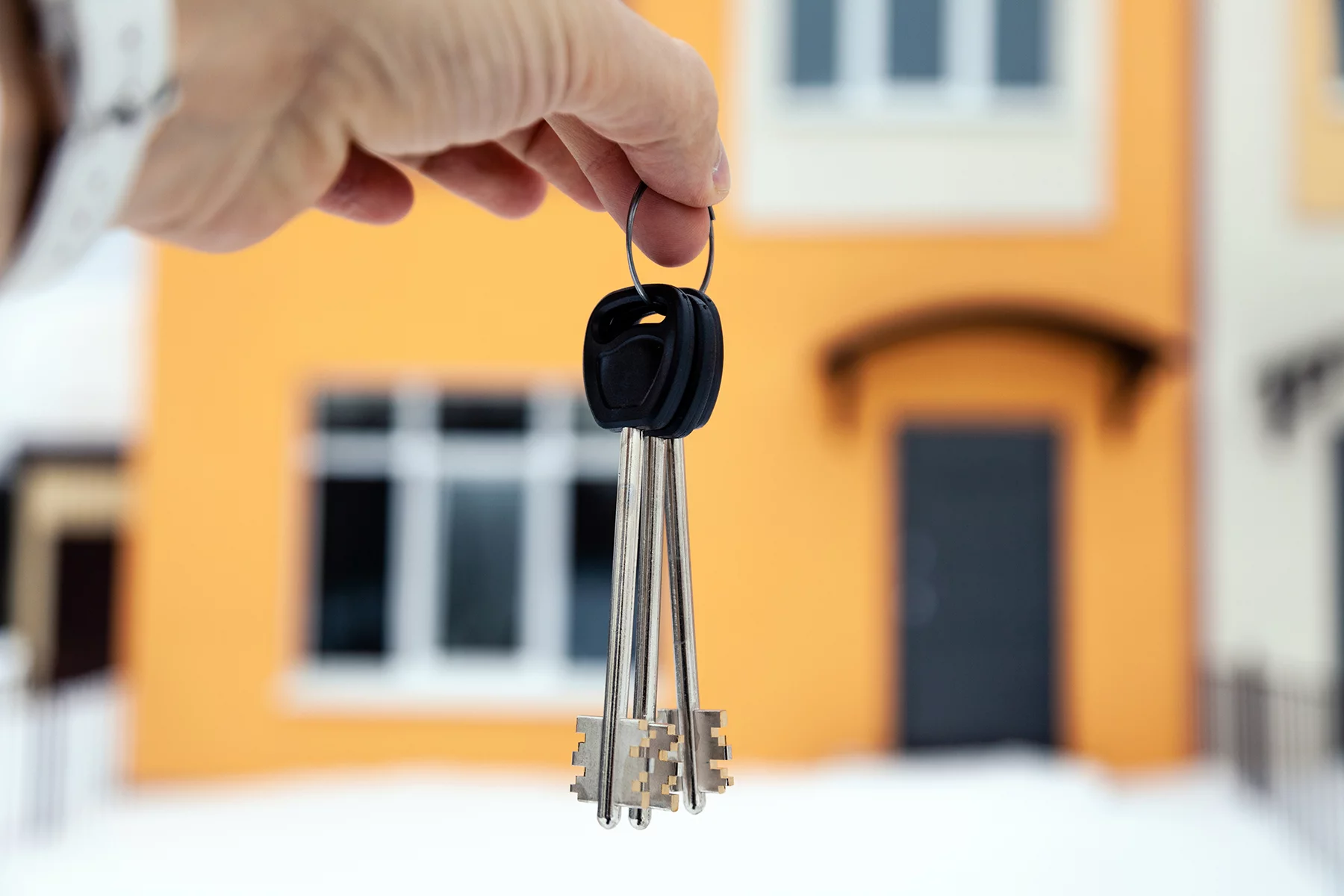 an agent holding the keys to a rental property
