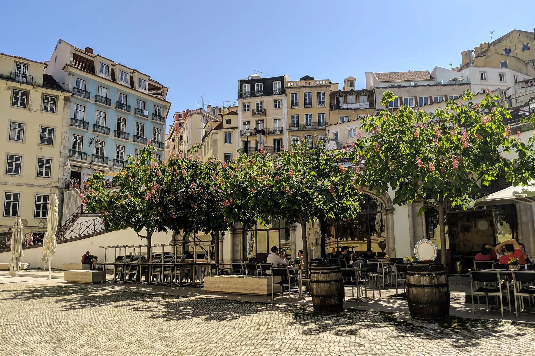 Outdoor café on a cobblestone square in Lisbon