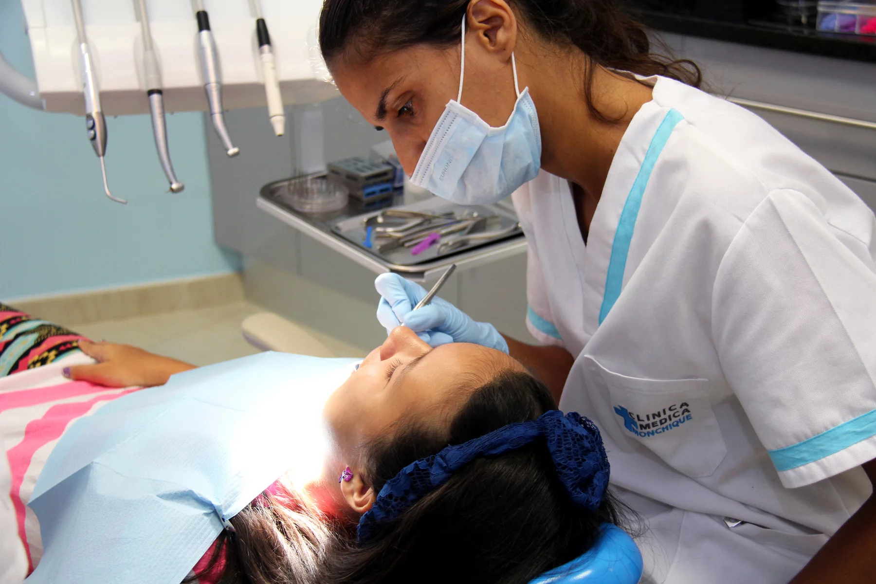 dentist in Portugal working on young patient