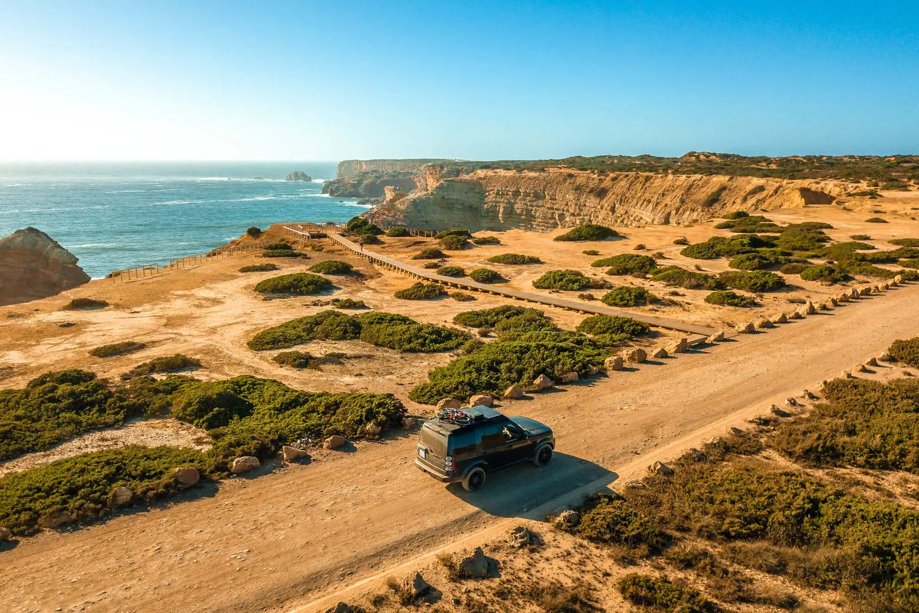 SUV driving along Portugal coastline