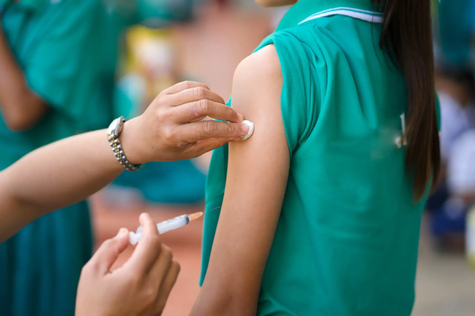 Teenage girl receiving an HPV vaccination