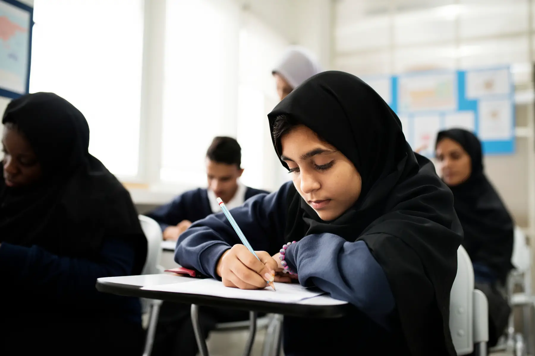 a classroom of muslim children at a public school in Qatar