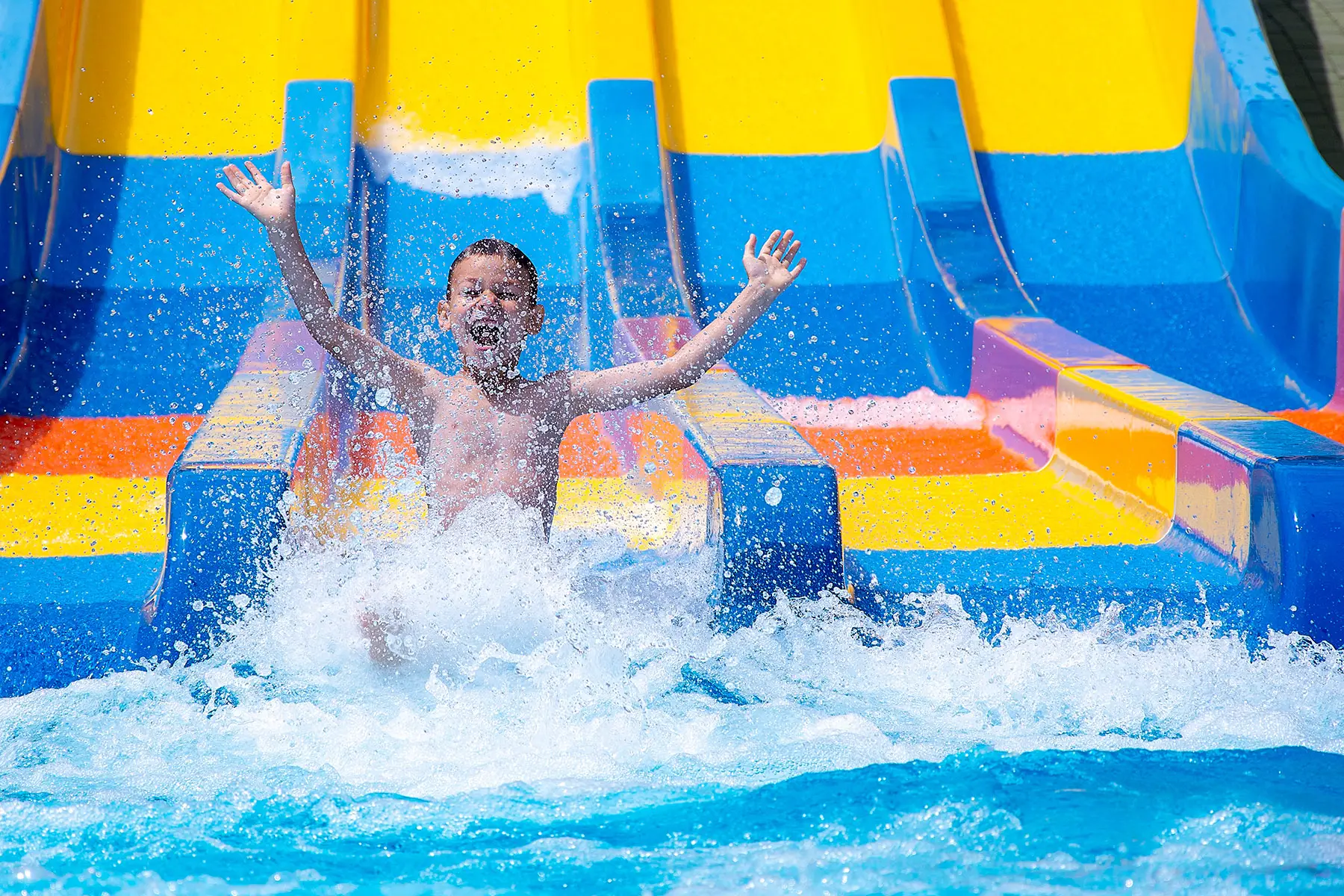 Boy on a slide at a water park