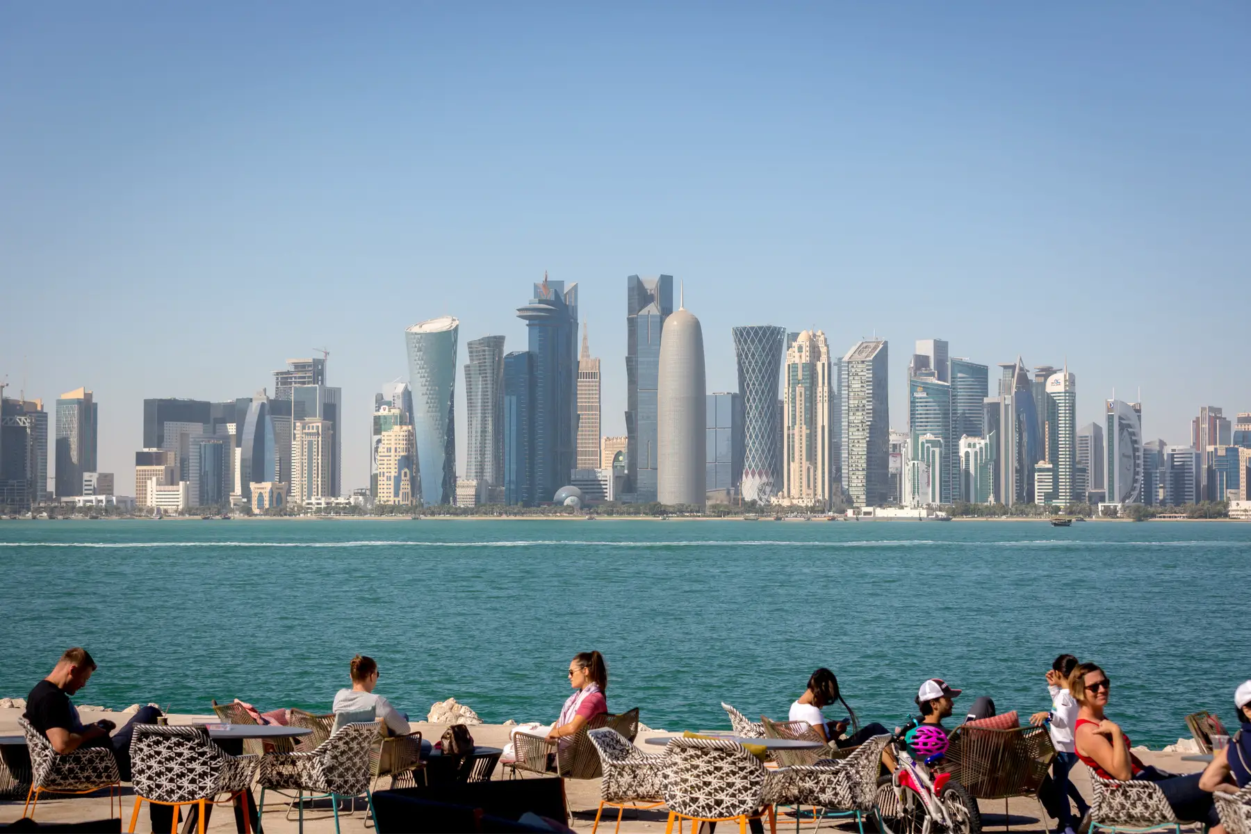 cafe patrons enjoy a view of Doha's skyline