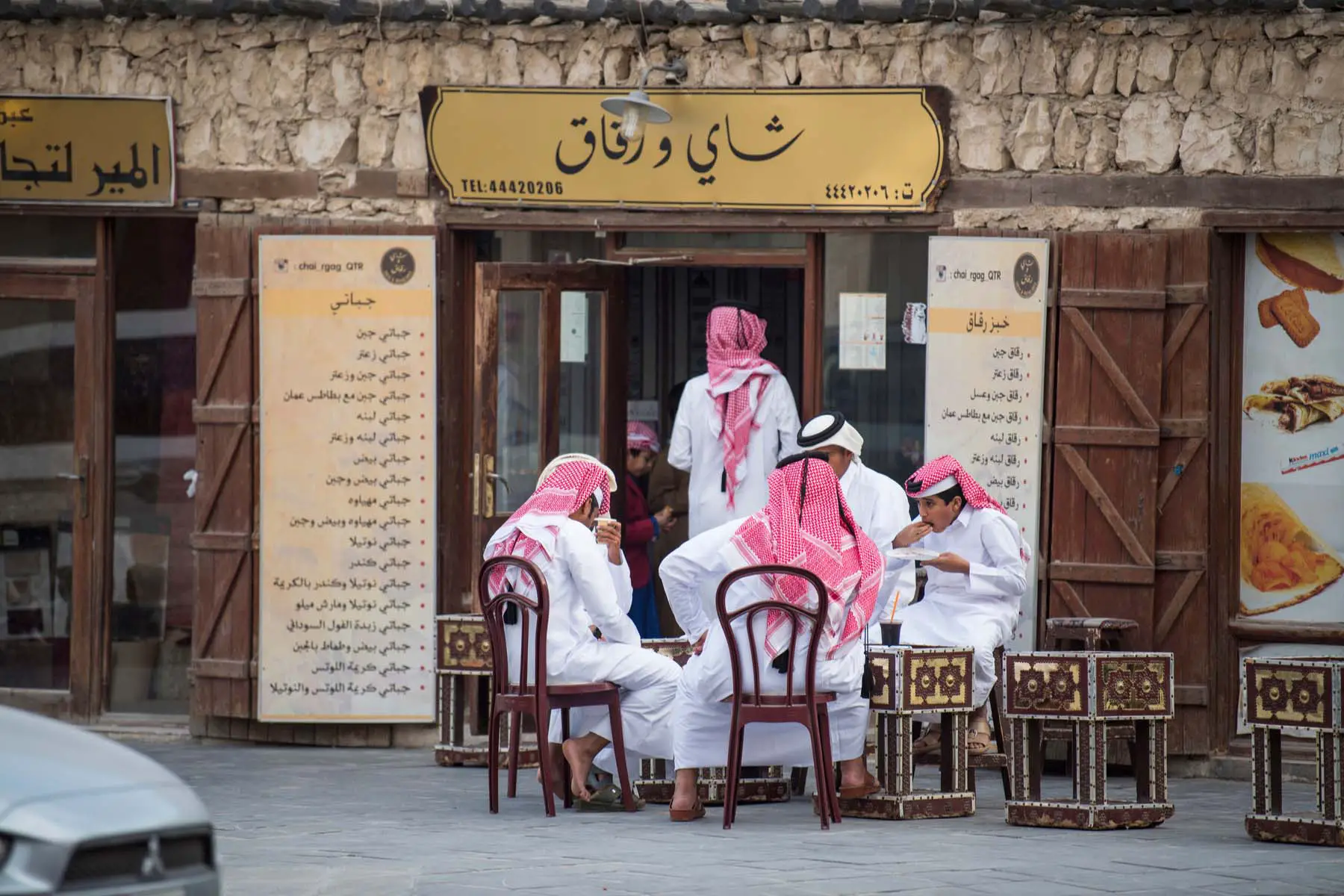 cafe in qatar busy with local men talking