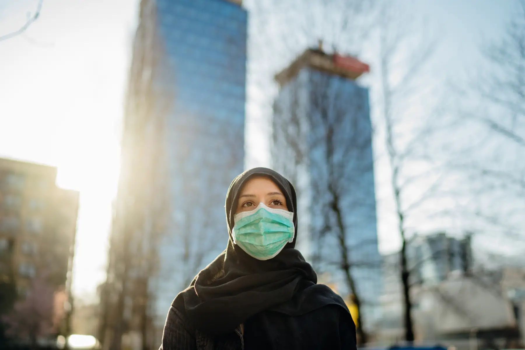 an Arab woman wearing a face mask in Qatar