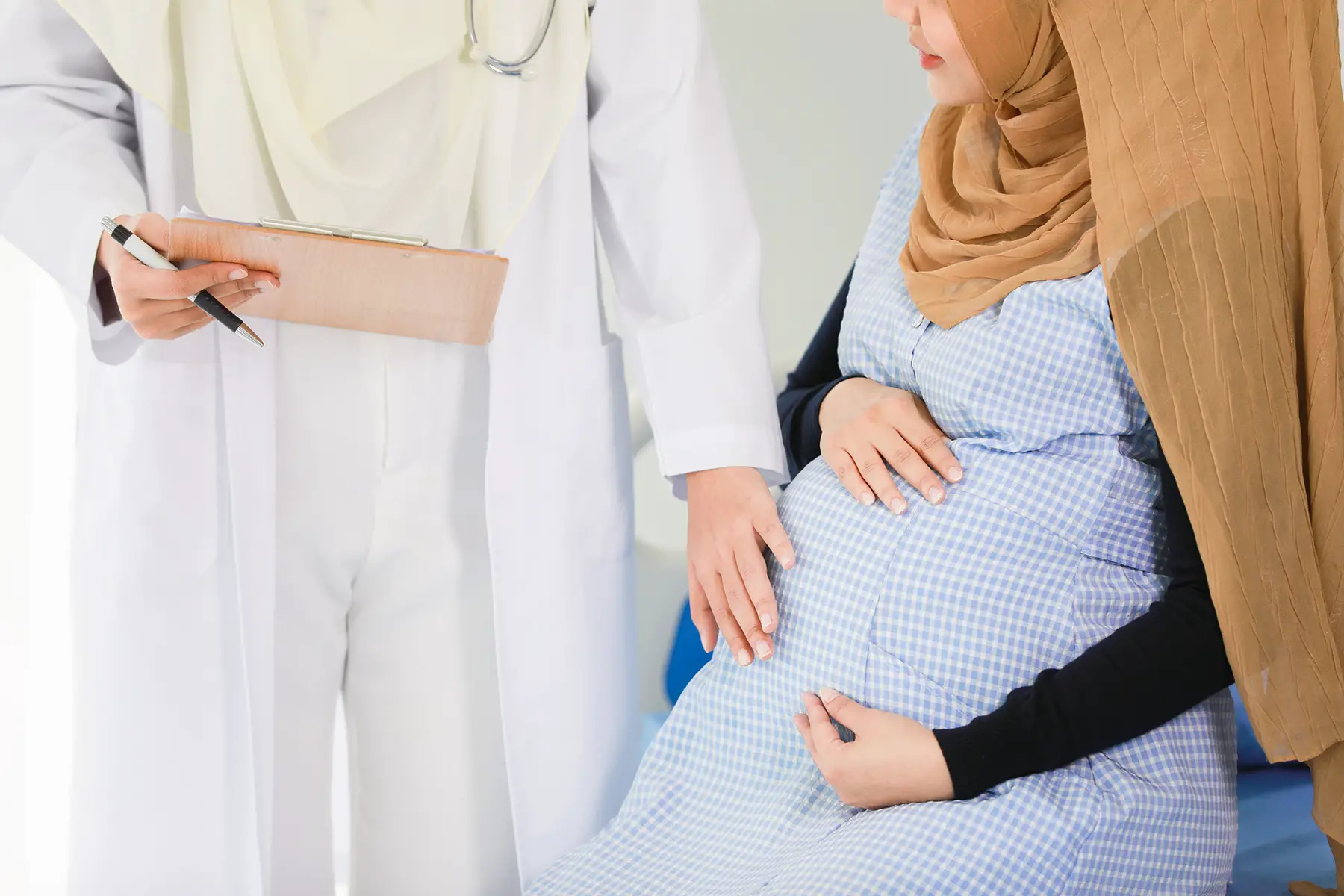 Pregnant Muslim woman at the doctor