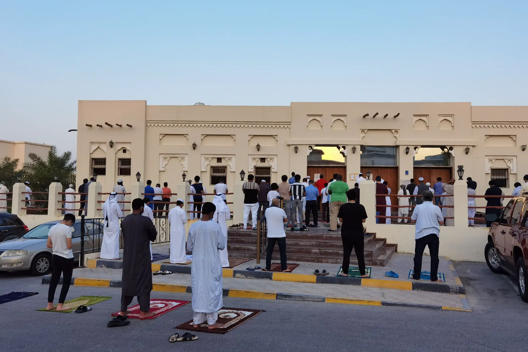 Muslims perform Eid al-Adha prayer while containing social distance the COVID-19 pandemic at Casim Al Sani Mosque in Doha, Qatar (2020).