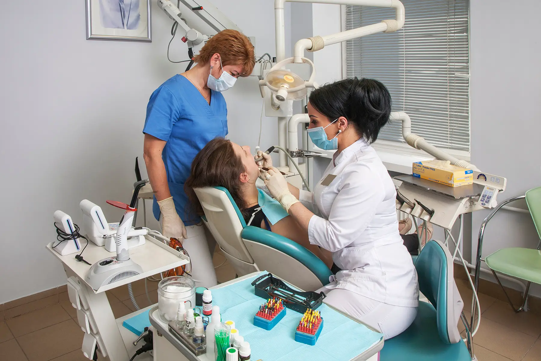 Two dentists with a patient