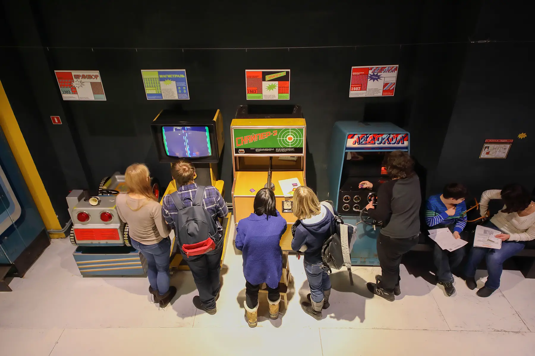 Aerial view of people playing games at the Museum of Soviet Arcade Games