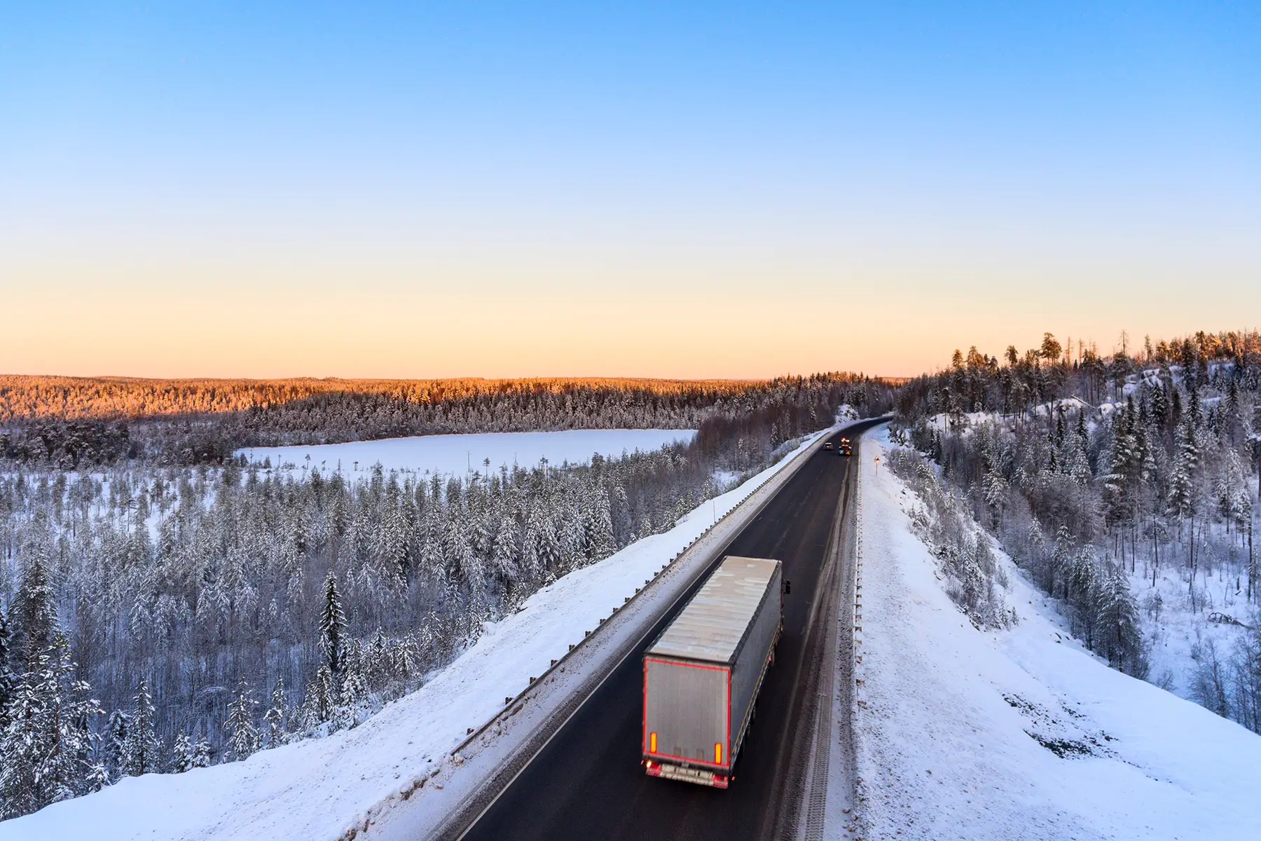 lone truck navigates wintry road in Russia